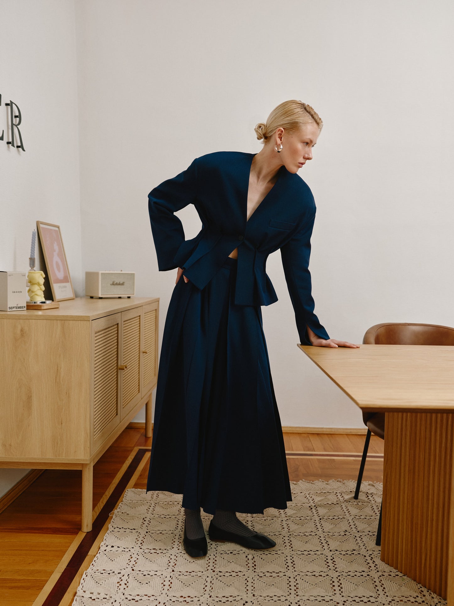 Short waist-length navy jacket.