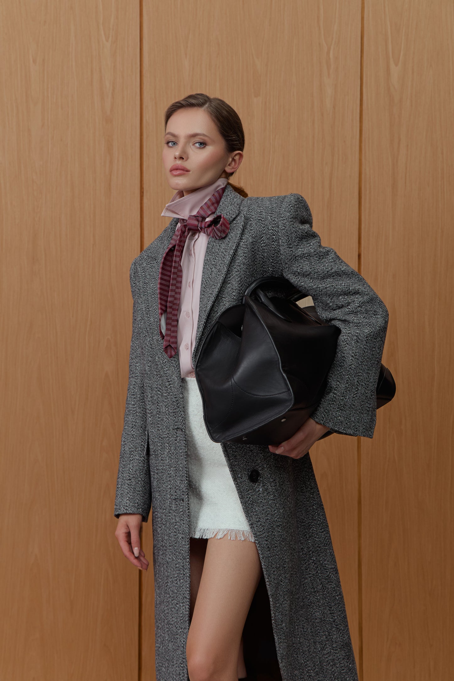 Insulated coat in black and white houndstooth print