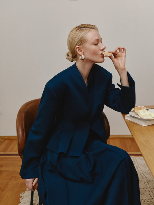 Short waist-length navy jacket.