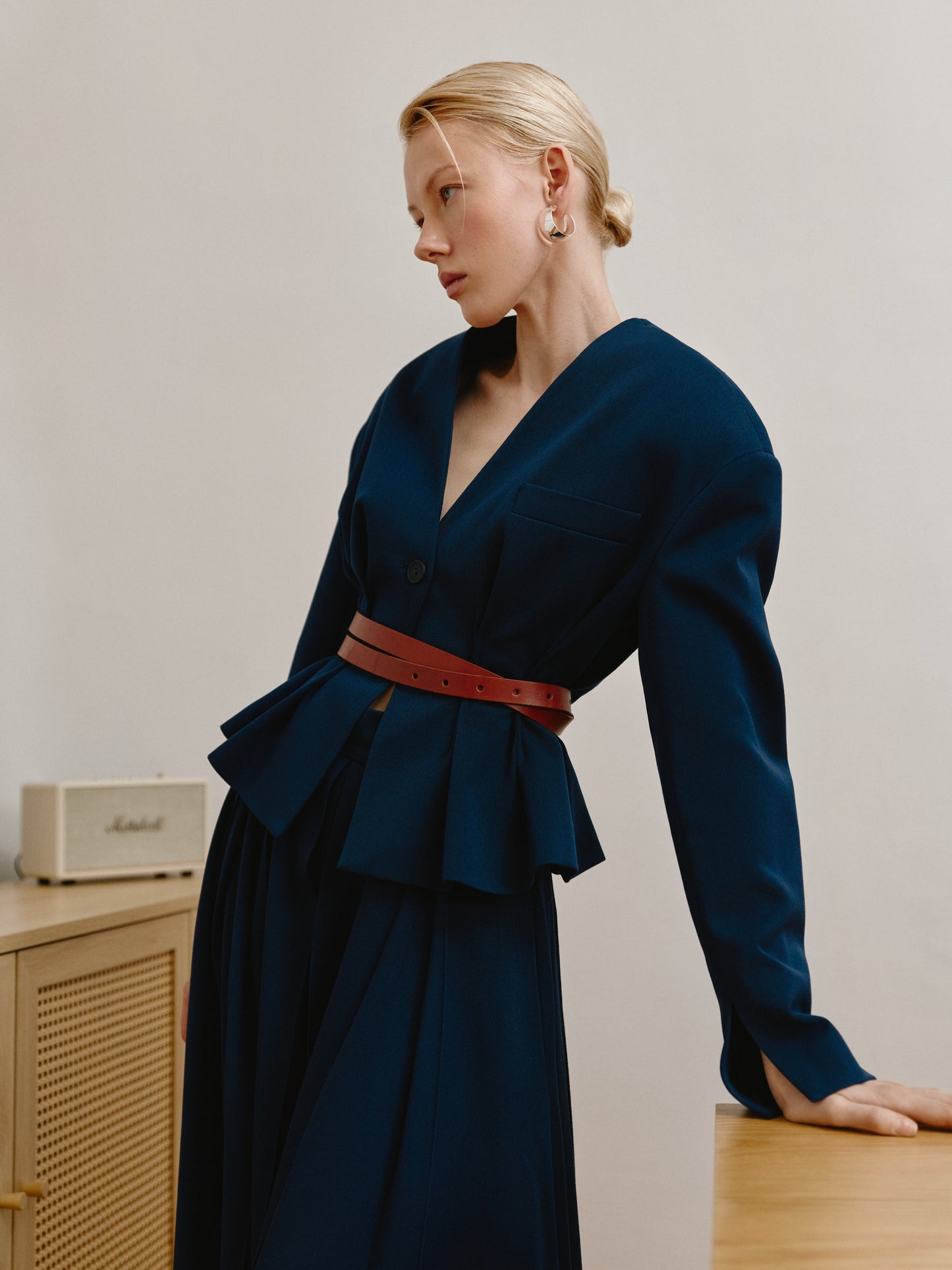 Short waist-length navy jacket.