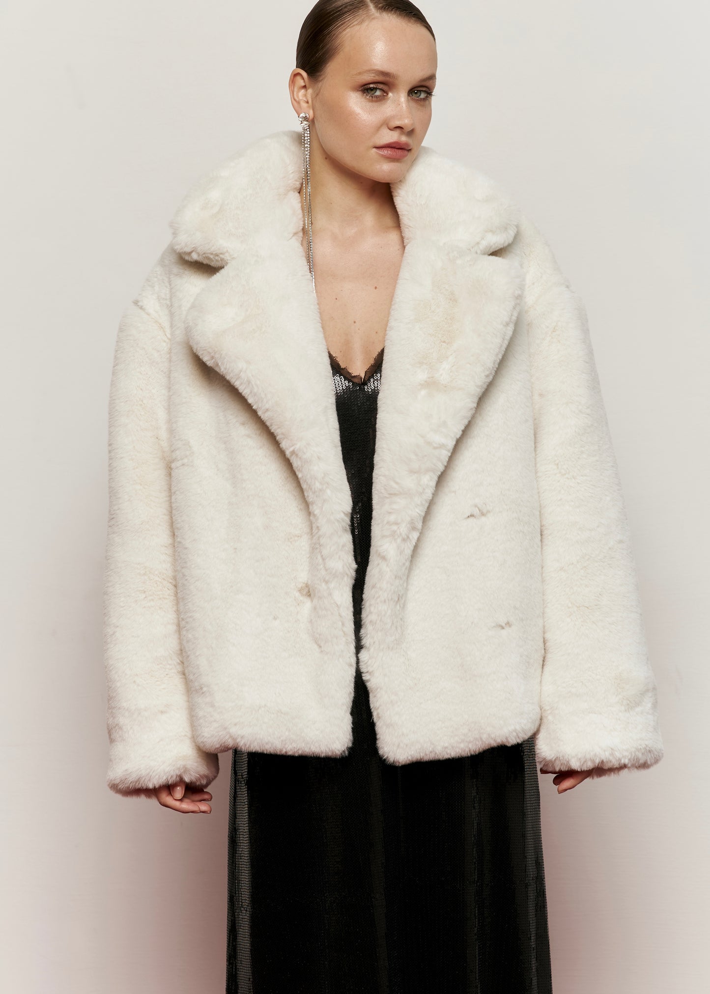 Milk-colored fur coat with smooth fur