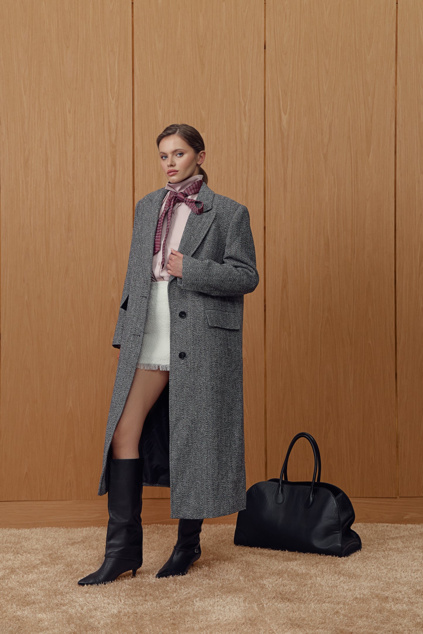 Insulated coat in black and white houndstooth print