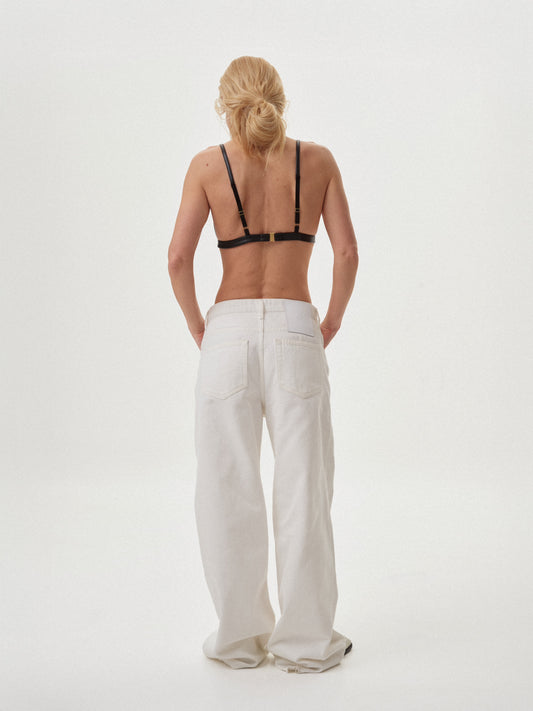 Молочні джинси широкого крою