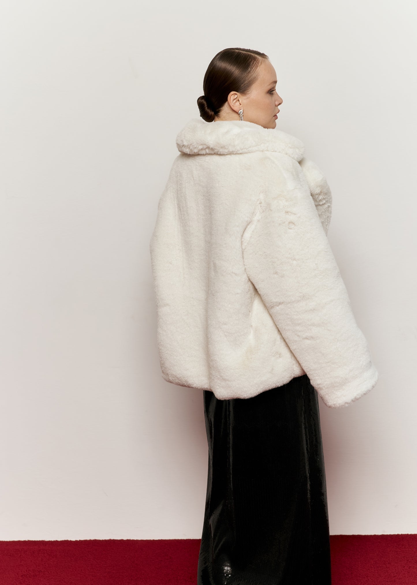 Milk-colored fur coat with smooth fur