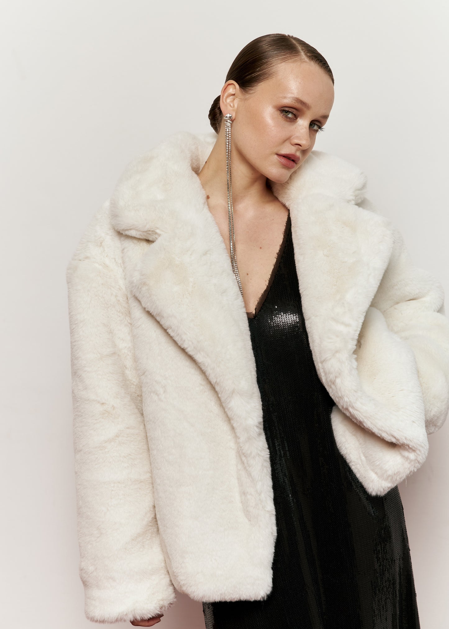 Milk-colored fur coat with smooth fur